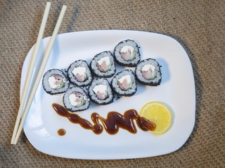 Sushi rolls closeup on burlap background