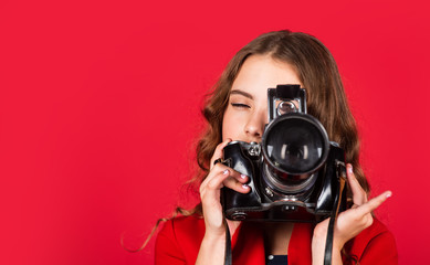 little reporter make photo. vintage camera. girl with retro camera. capture childhood memories. SLR...