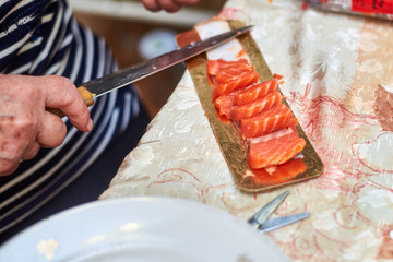 Making sandwiches with red fish