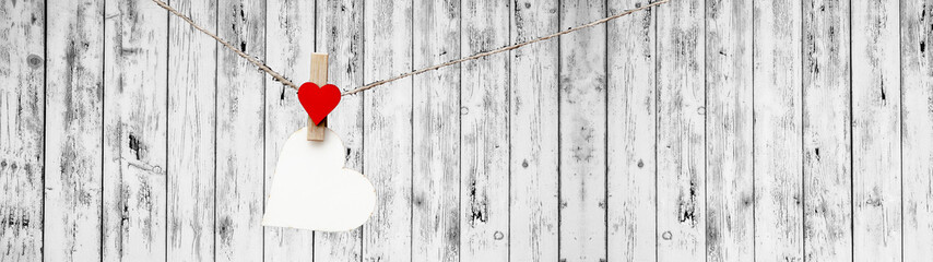 Happy Valentine's Day background banner panorama - Red paper note hang on wooden clothes pegs with...