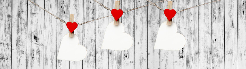 Happy Valentine's Day background banner panorama - Red paper note hang on wooden clothes pegs with...