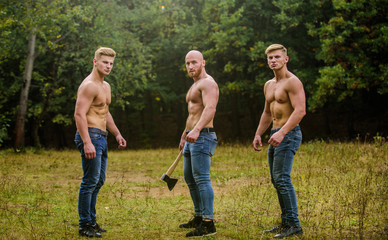 Three sexy guys. brutal guys pose with naked torso. handsome guys with sexy body. Sports and...