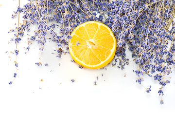Fresh blue lavender with big lemon slice on white isolated background