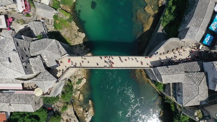 Aerial top down view of old medieval bridge in Mostar, Stari Most, Neretva river, Bosnia and...