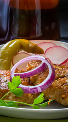 chopped steak grilled with red onions radishes and hot peppers