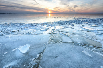 shelf ice on big frozen lake in winter