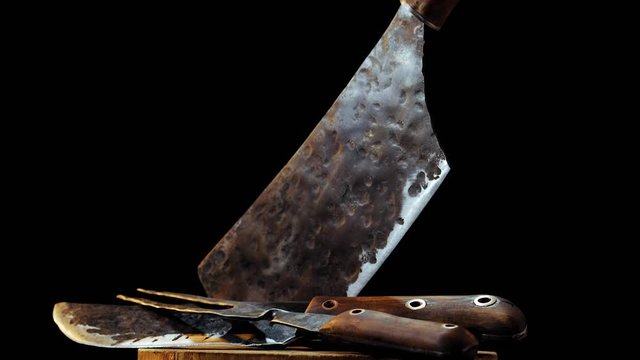 Panoramic view of rustic butcher meat knife, cleaver and fork