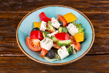 Greek salad, with cheese and fresh vegetables with seasonings