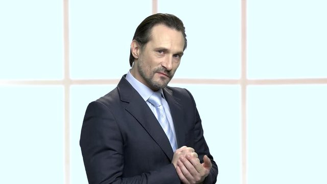 Aggressive mature businessman planning a revenge. Angry male entrepreneur ready for fight. Human body language.