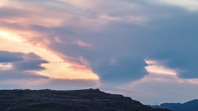 Time-lapse footage of lenticular cloud formation (Altocumulus lenticularis) at sunset on the Highlands of Scotland. Loch Maree, Wester Ross, Scotland, UK 
