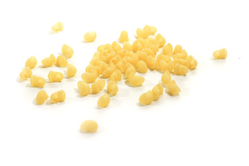 Curved raw pasta on a white isolated background