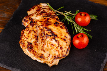 Chicken steak with cherry tomatoes and greens