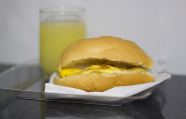 Bread with scrambled egg. Brazilian snack knows as 