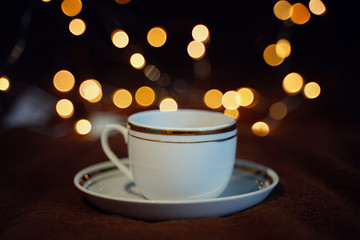 Cup of tea on bokeh background