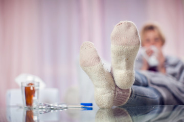 Woman got the flu and drinking hot tea. People, healthcare and medicine concept