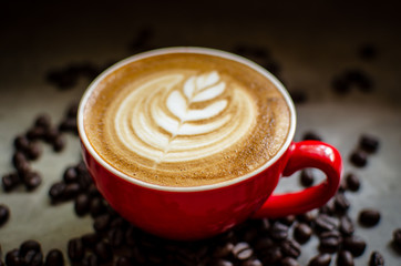 hot latte art in red mug