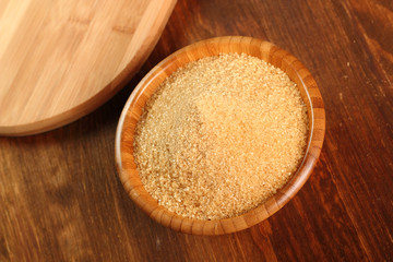 Cane Sugar in wooden bowl