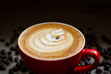 hot latte art in red mug