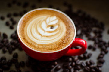 hot latte art in red mug