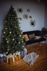 Beautiful modern gray apartment room, decorated for New Year and Christmas.