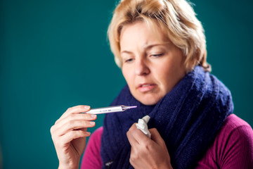 Fototapeta premium Woman got the flu and measuring temperature. People, healthcare and medicine concept