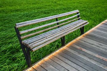bamboo bench against rice field