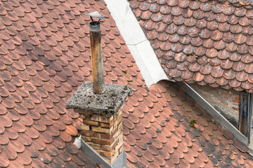 chimney on roof tiles of a house as a background