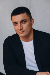 Obraz premium Photo session of a young guy. Classic portrait of a confident man.