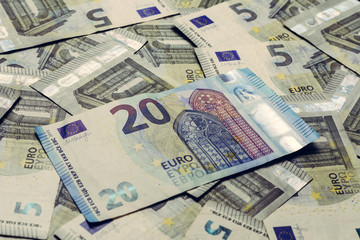 Fototapeta na wymiar European money is in textures, denominations of 20 and 5 euros.