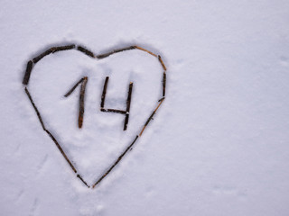 heart in the snow and the number 14, copy space
