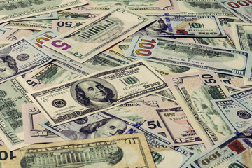 The dominant currency of the world, dollar bills in textured form.