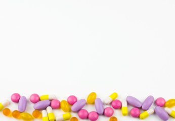 various medicines, colored capsules, pills, pharmacy drugs on a white background, the concept of medicines, pharmacy business