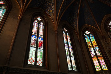 Fototapeta premium Stained glass windows of a private chapel in a a medieval castle. Three windows.