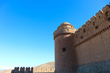 Obraz premium Tower and wall of medieval castle La Calahorra, Granada, Andalucia, Spain