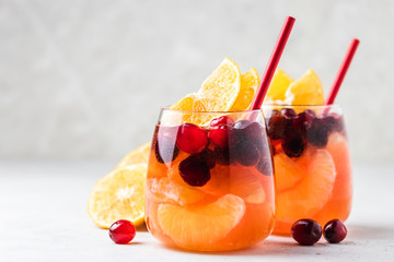 Non-alcoholic cranberry orange spritzer. Selective focus, copy space.