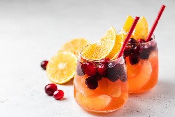 Non-alcoholic cranberry orange spritzer. Selective focus, copy space.