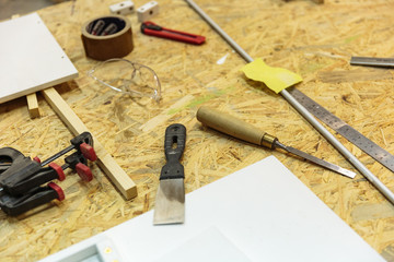 set of carpenters tool on tne wood and shavings