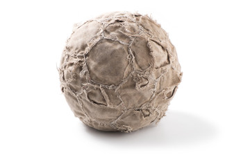 Old, shabby leather soccer ball on white background.