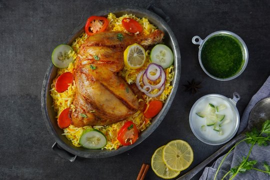Chicken Kabsa/ kuzhi Mandhi or Mandi Biryani served with yogurt mint chutney