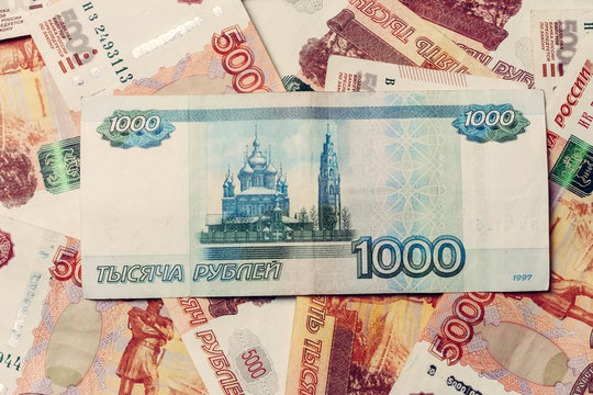 Texture of banknotes in denominations of 5000 and 1000 Russian rubles.