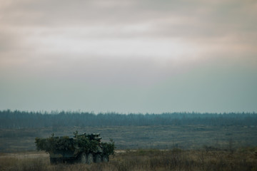 Military patrol car on a field. Army war concept.