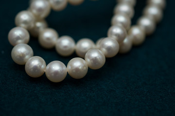 pearl necklace on dark background macro local focus perl jewerly close up