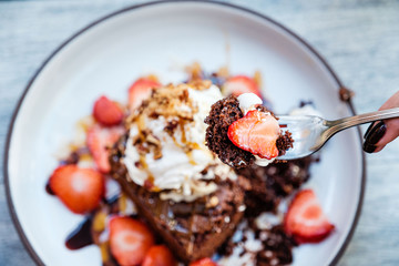 Bite of brownie sundae on a fork