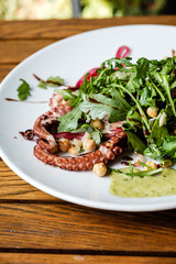 Salad with octopus on a plate