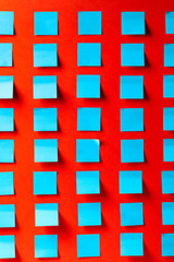 Blue empty stickers on a red background.