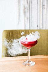 Smoking cocktail drink with fruit
