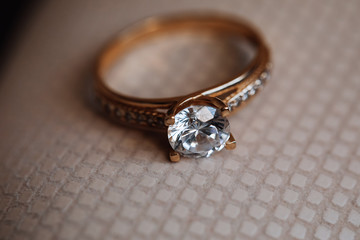 Precious golden engagement ring with big diamond