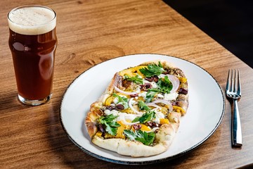 Pizza and beer on a table
