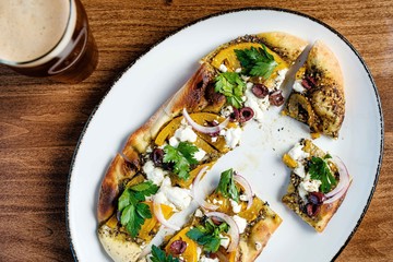 Pizza and beer on a table