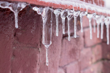 Ice icicle on the edge of the eaves.